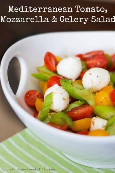 A bowl of food on a plate, with Salad and Mozzarella