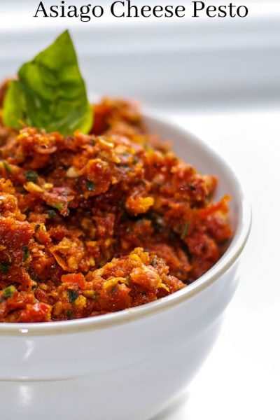 A close up of Sun Dried Tomato and Asiago Cheese Pesto in a bowl.