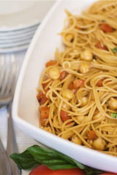 Whole grain spaghetti tossed with homemade tomato bruschetta, chick peas and grated Pecorino Romano cheese is a tasty, quick weeknight dinner. 