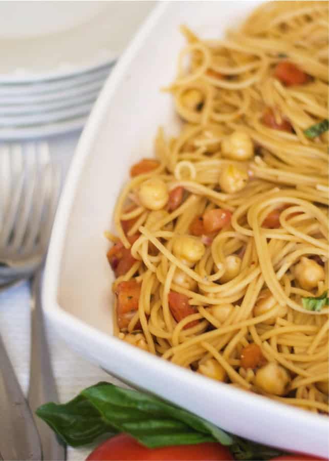 Whole grain spaghetti tossed with homemade tomato bruschetta, chick peas and grated Pecorino Romano cheese is a tasty, quick weeknight dinner. 