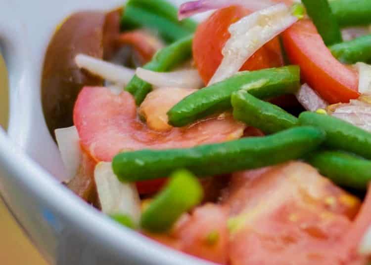 A bowl of Green Bean and Tomato Salad with Ginger Wasabi Vinaigrette
