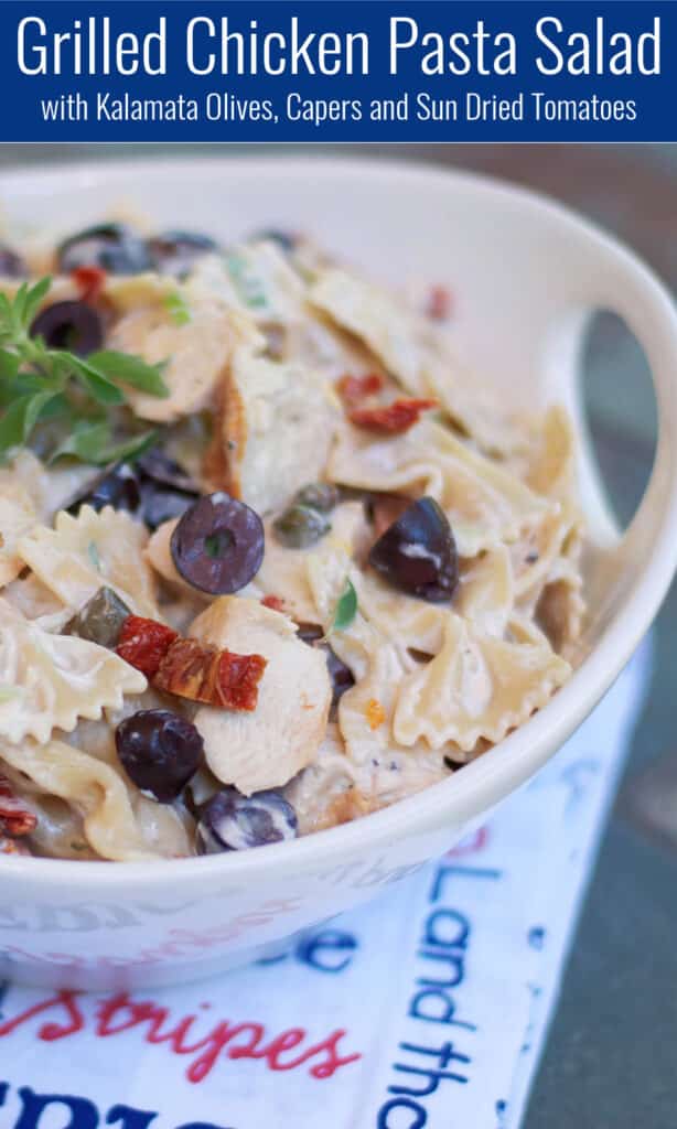 Grilled Chicken Pasta Salad with Kalamata Olives, Capers and Sun Dried Tomatoes in white bowl