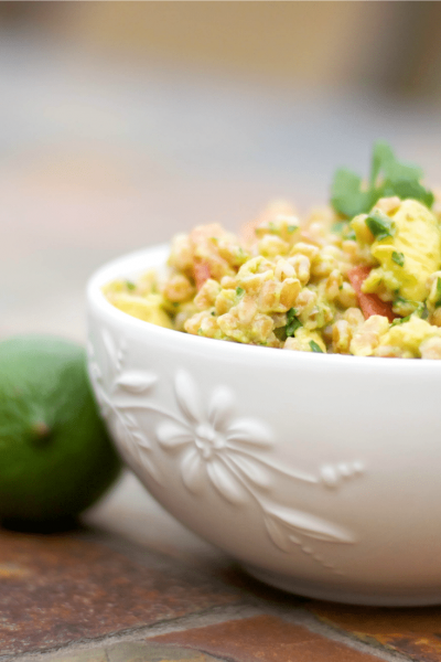 Guacamole Farro Salad in a white bowl.