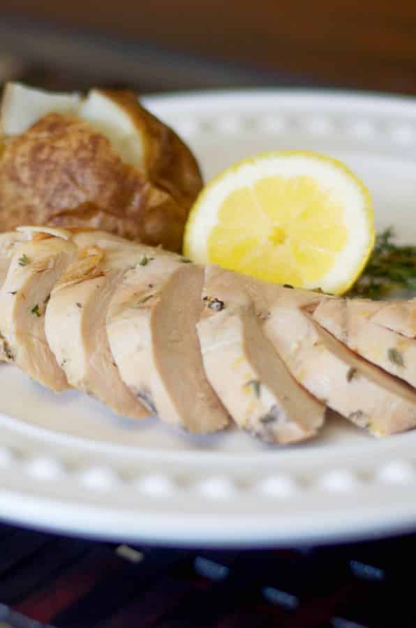 Boneless chicken breasts marinated in a brine made with sea salt, sugar, fresh thyme, lemon juice and zest; then grilled is super juicy. 