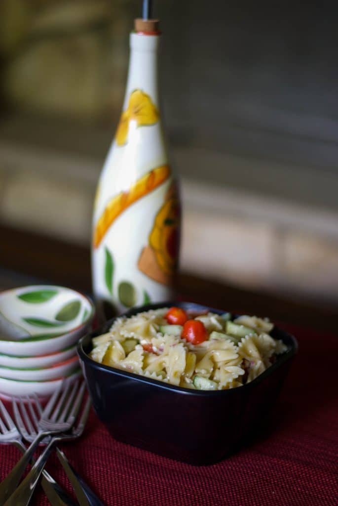 Mediterranean Pasta Salad made in a bowl on a table. 