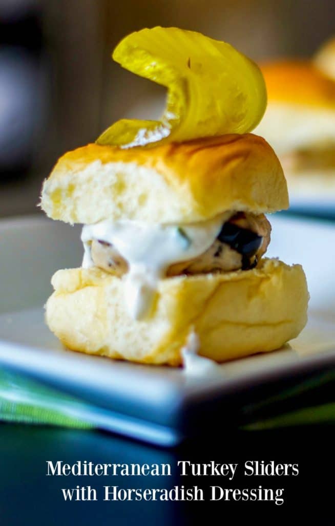 Mediterranean Turkey Sliders made with lean ground turkey, Kalamata olives, Feta cheese, and oregano on top of a sweet slider bun. 