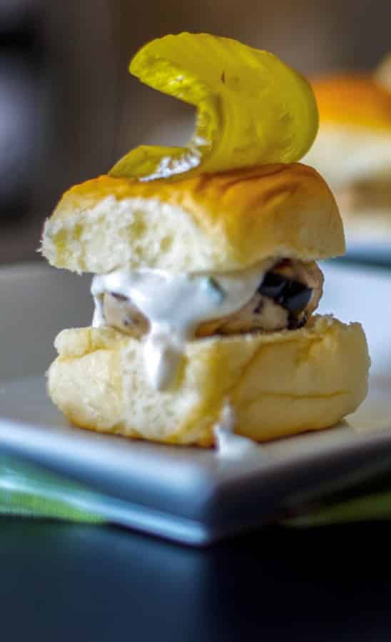 Mediterranean Turkey Sliders made with lean ground turkey, Kalamata olives, Feta cheese, and oregano on top of a sweet slider bun.