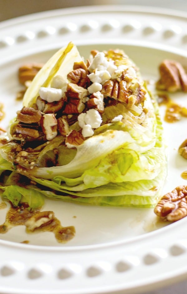  Grilled Iceberg lettuce wedge salad topped with whole pecans and crumbled Goat cheese; then drizzled with a balsamic vinaigrette. 