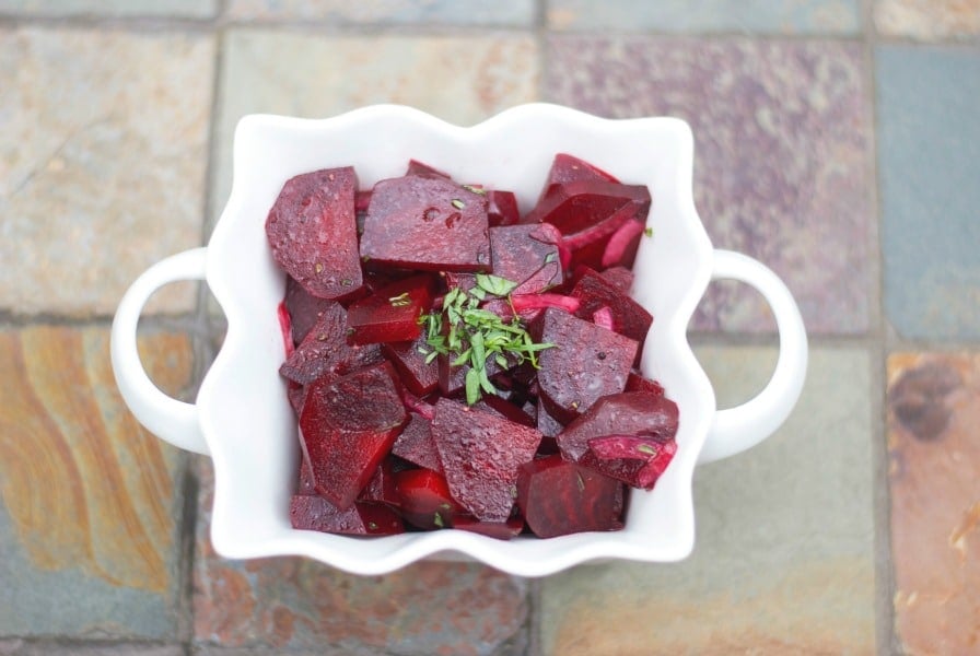 a bowl of pickled beets on the table