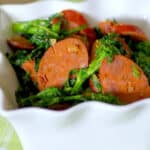 chorizo and broccoli rabe in a white dish