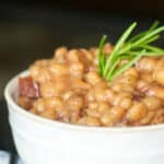 Italian Baked Beans made with white beans, turkey bacon, rosemary, tomatoes, Italian dry red wine and Asiago and Pecorino Romano cheeses.