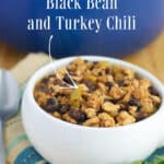 Black Bean and Turkey Chili in a white soup crock and a blue Dutch oven