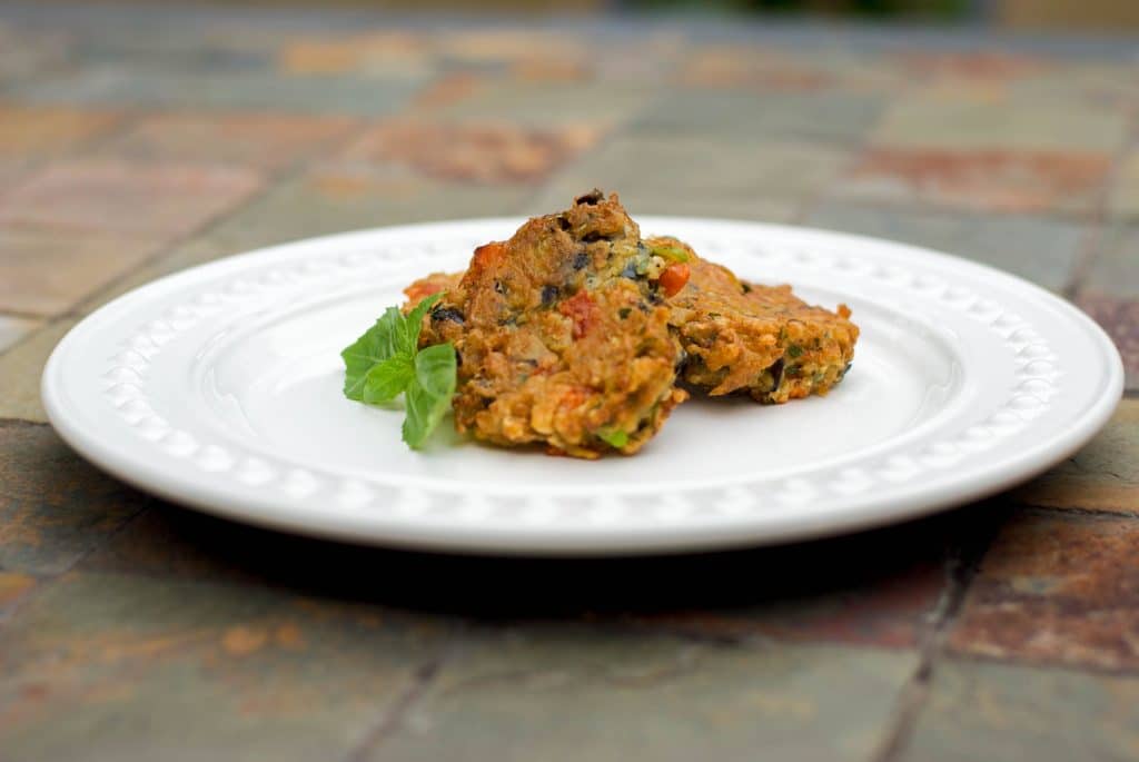 Eggplant Fritters on a white serving plate. 