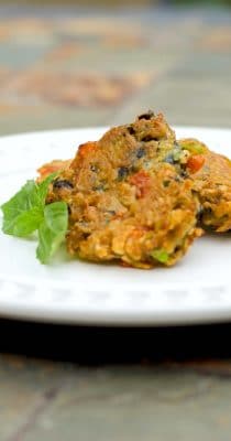 Learn how to make this tasty Greek style side dish for Eggplant Fritters with grated eggplant, garlic, basil, tomatoes and scallions.