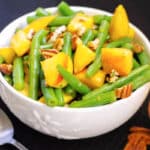 Green Bean and Peach Salad in a white bowl. 