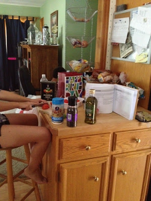 A person sitting on a kitchen counter