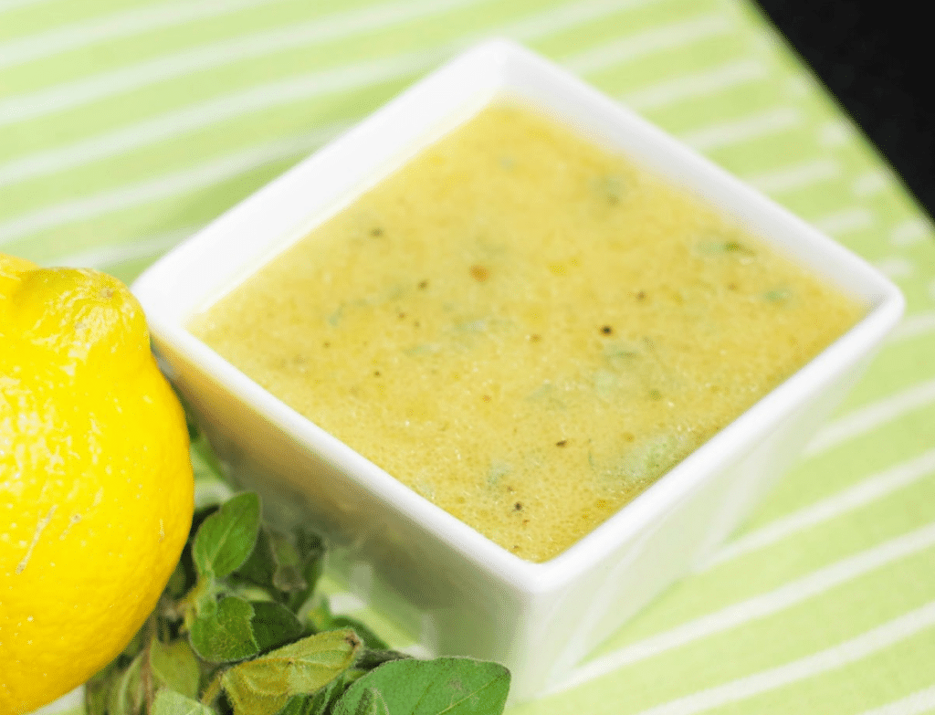 a close up of ladolemono in a bowl