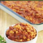Baked Beans made with Navy beans, Portuguese chourico, peppers, and garlic in a tomato-based sauce.