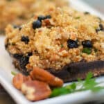 portobello mushroom caps stuffed with quinoa on a plate