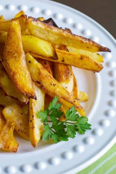Buffalo Roasted Potato Wedges made with russet potatoes and tossed with melted butter and hot sauce; then roasted until golden brown. 