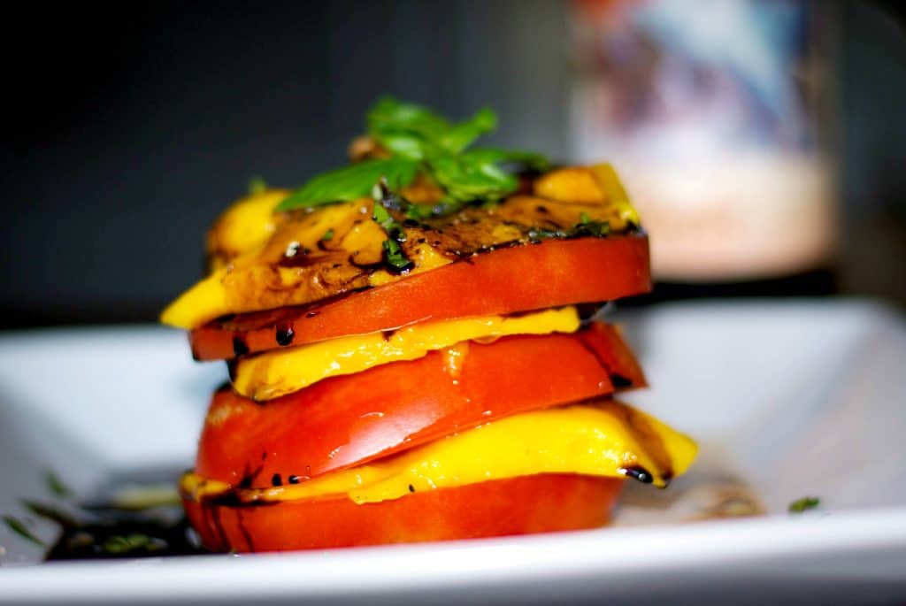 Stacked Heirloom Tomato & Mangoes with Balsamic Reduction 