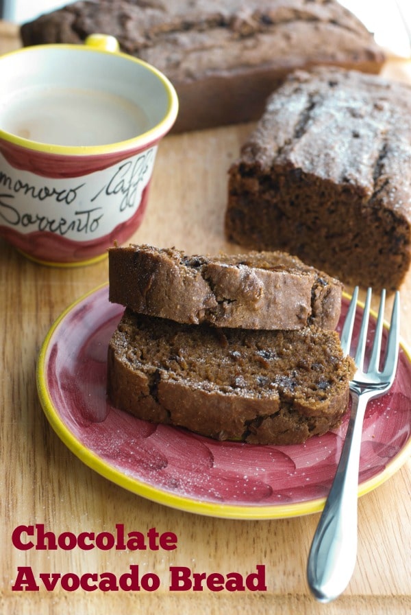 Two slices of Chocolate Avocado Bread on a plate with a fork. 