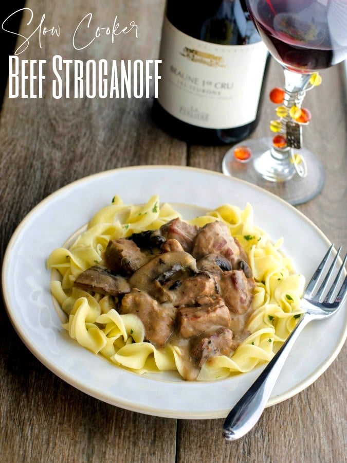 beef stroganoff over egg noodles on a plate