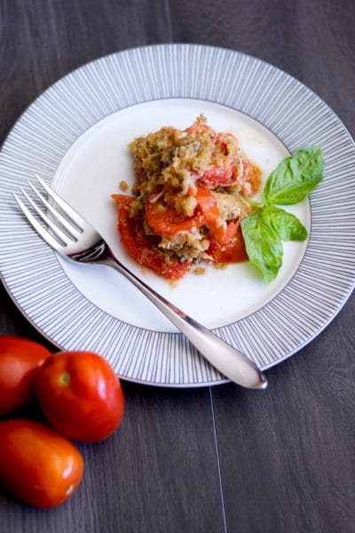 Tomato Gratin on a plate with a fork.