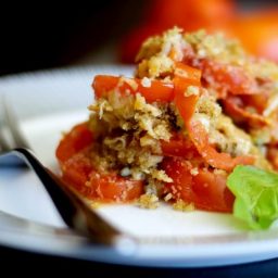 A close up of tomato gratin on a plate.