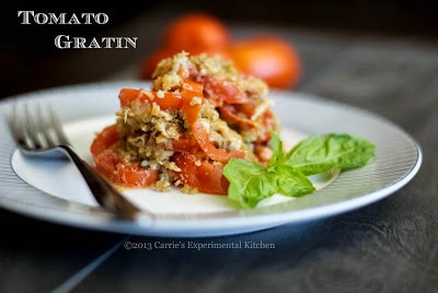 a close up of tomato gratin with a fork