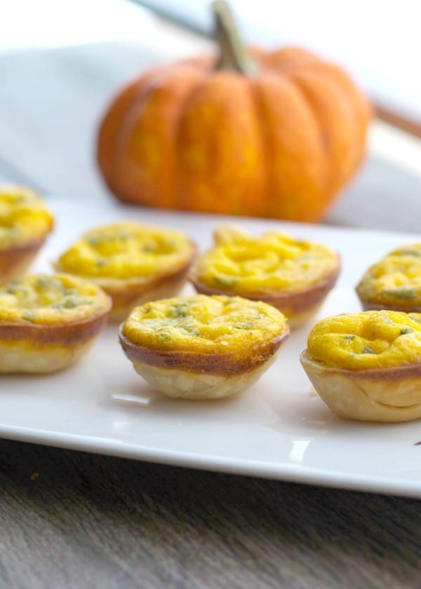 These Pumpkin & Brie Mini Quiche are delicious and so easy to make. Use a mini muffin tin to create individual appetizers for your holiday gathering.
