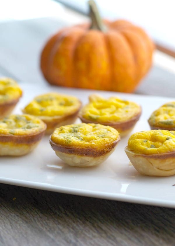  Pumpkin and Brie Mini Quiche on a white plate. 