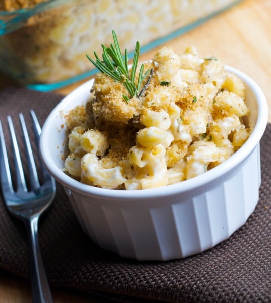 A close up of Rosemary and Goat Cheese Mac n\' Cheese in a white dish. 