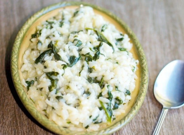 A close up of food on a table, with Spinach risotto