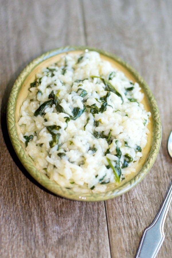  Spinach Risotto in a dish on a table. 