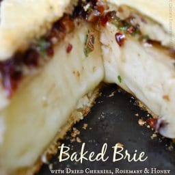 A close up of a Baked Brie with Cherries