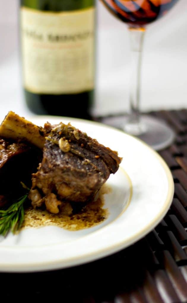 Beef short ribs slowly cooked in red wine, garlic, rosemary and two types of mustard are so tender and delicious. 