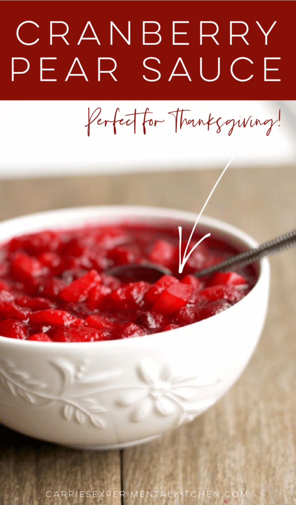 cranberry pear sauce in a white bowl with a spoon