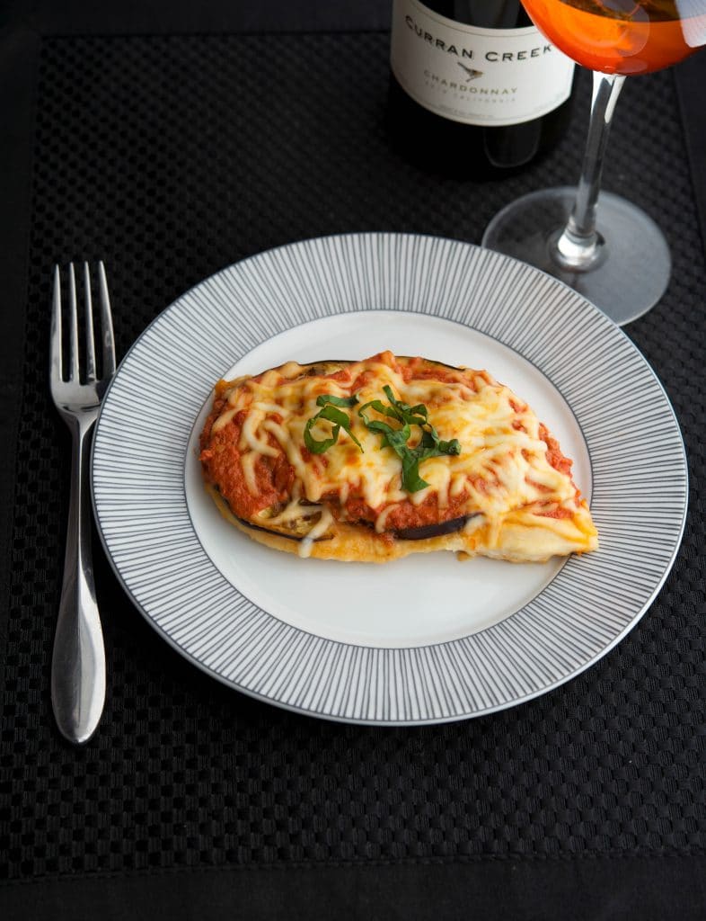 Chicken Melanzana: Boneless chicken breasts topped with eggplant, ripe tomatoes, marinara sauce and Mozzarella cheese.