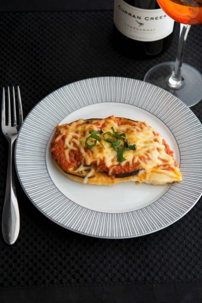 Chicken Melanzana: Boneless chicken breasts topped with eggplant, ripe tomatoes, marinara sauce and Mozzarella cheese.