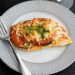 Chicken Melanzana is a tasty, Italian meal made with boneless chicken breasts, eggplant, ripe tomatoes, marinara sauce and Mozzarella cheese.