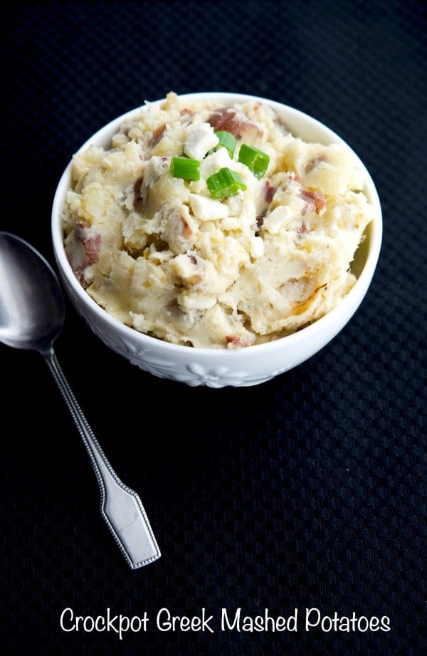 Greek Mashed Potatoes made in the crockpot with red bliss potatoes, scallions, oregano, lemon and Feta cheese make a tasty, easy side dish.