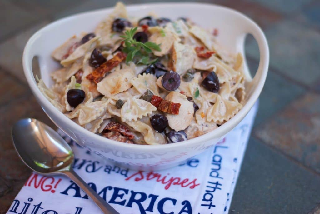 A bowl of grilled chicken pasta salad. 