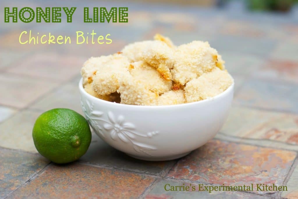 A bowl of Honey Lime Chicken Bites on a slate table. 
