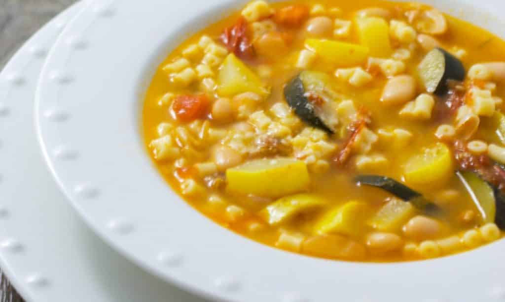 A plate of food, with Soup and Minestrone