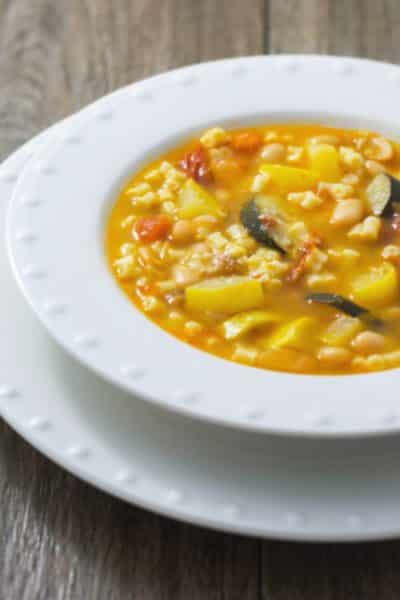 This hearty Minestrone Soup made with squash, tomatoes, pasta, garlic and Ditalini pasta is so filling, you can eat it for dinner.