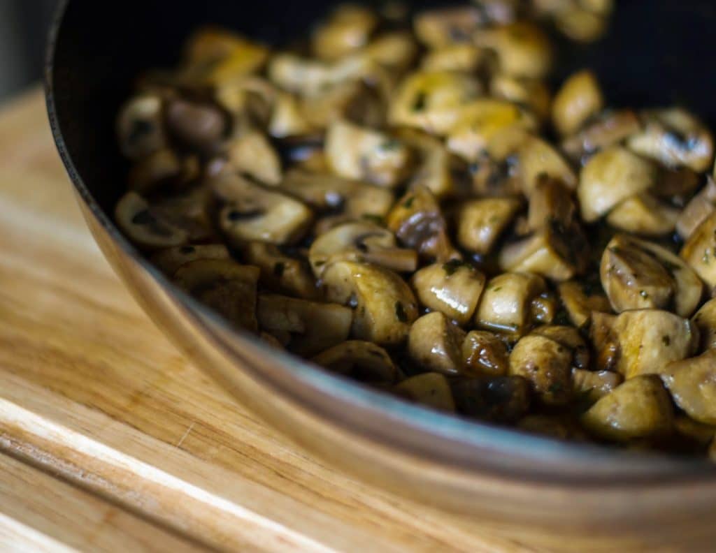 A close up of Mushrooms Vittoria in a pan. 