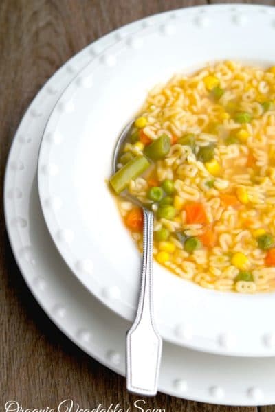 Alphabet Soup in a bowl with a spoon.