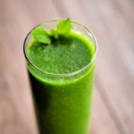 spinach pear mint smoothie on a board