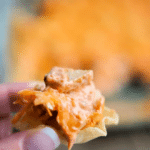 buffalo chicken dip on a tortilla chip